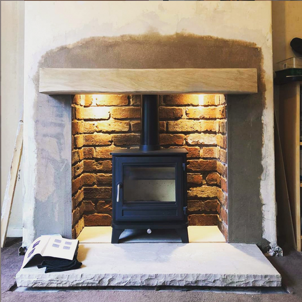 Chesneys Salisbury 5kW stove fitted with wood beam in Lancashire