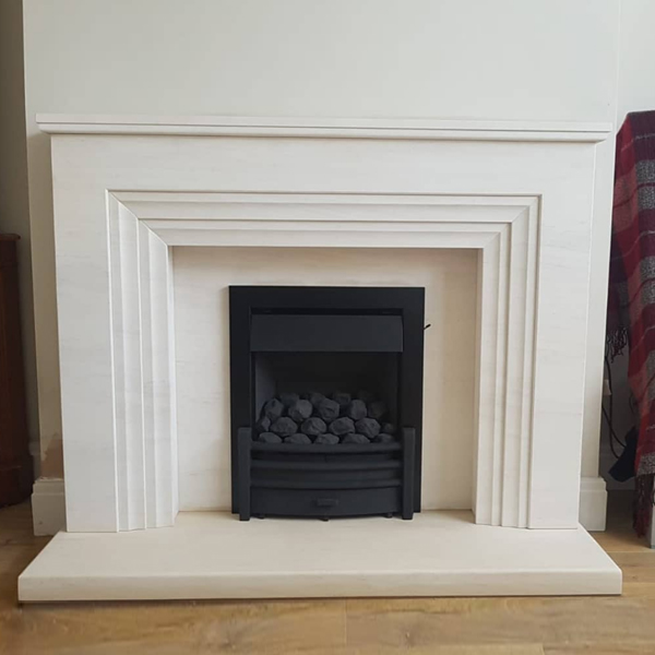 Kinder Oasis Plus gas fire in limestone fireplace suite Stockport